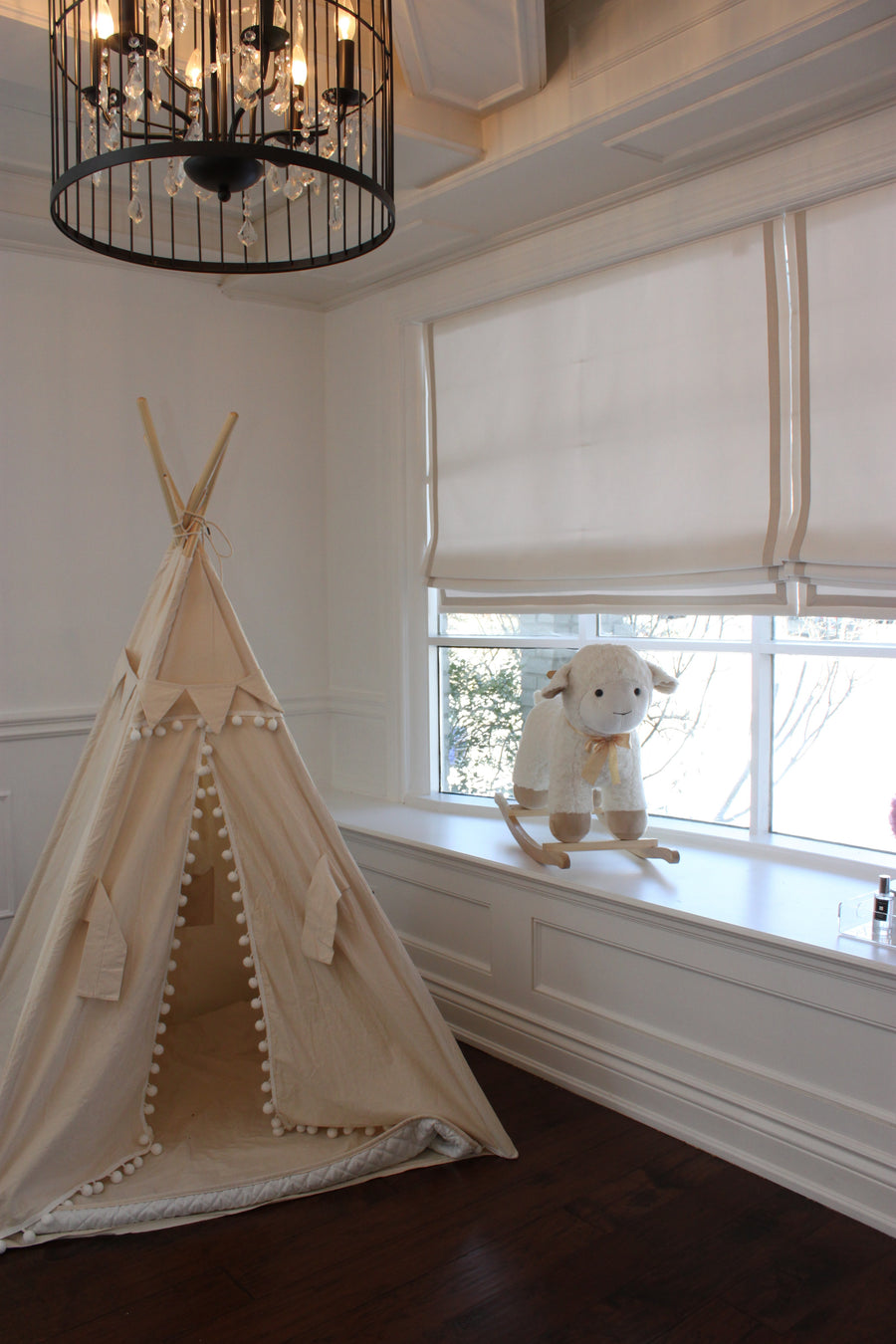 Bedroom-style room with a linen Roman shade