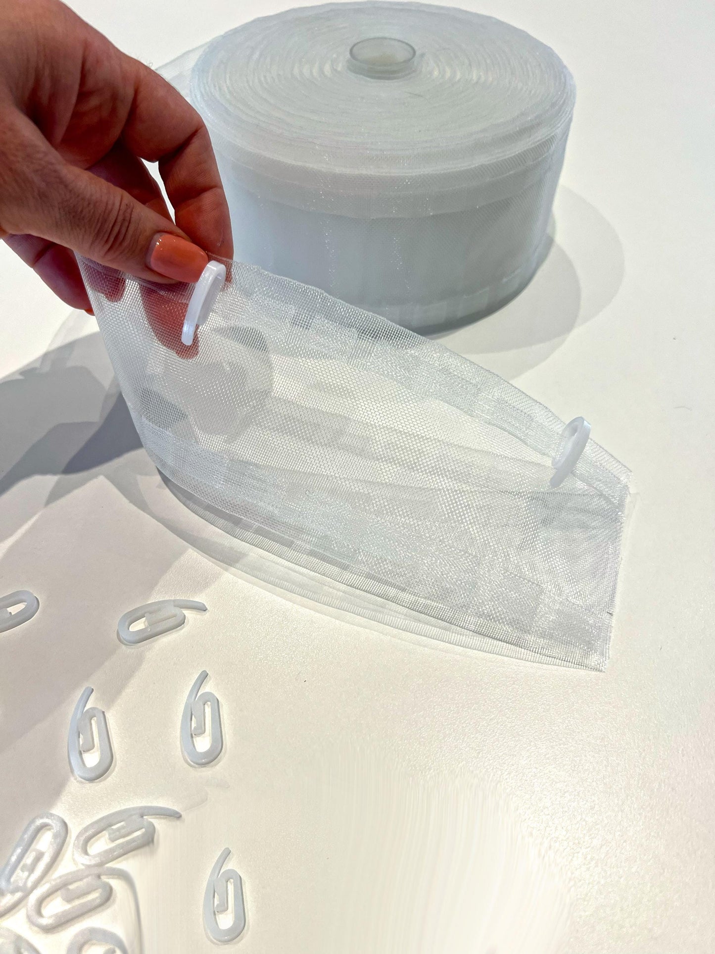 White plastic shirring hooks for pulse tape curtains