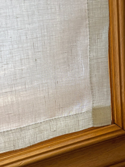 Close-up of the deep, perfectly level bottom hem on a flat-style Utopia Natural sheer linen cafe curtain