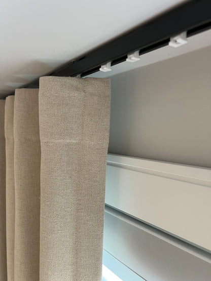 Far ripple fold drapery on a track, interior view of a finished custom panel