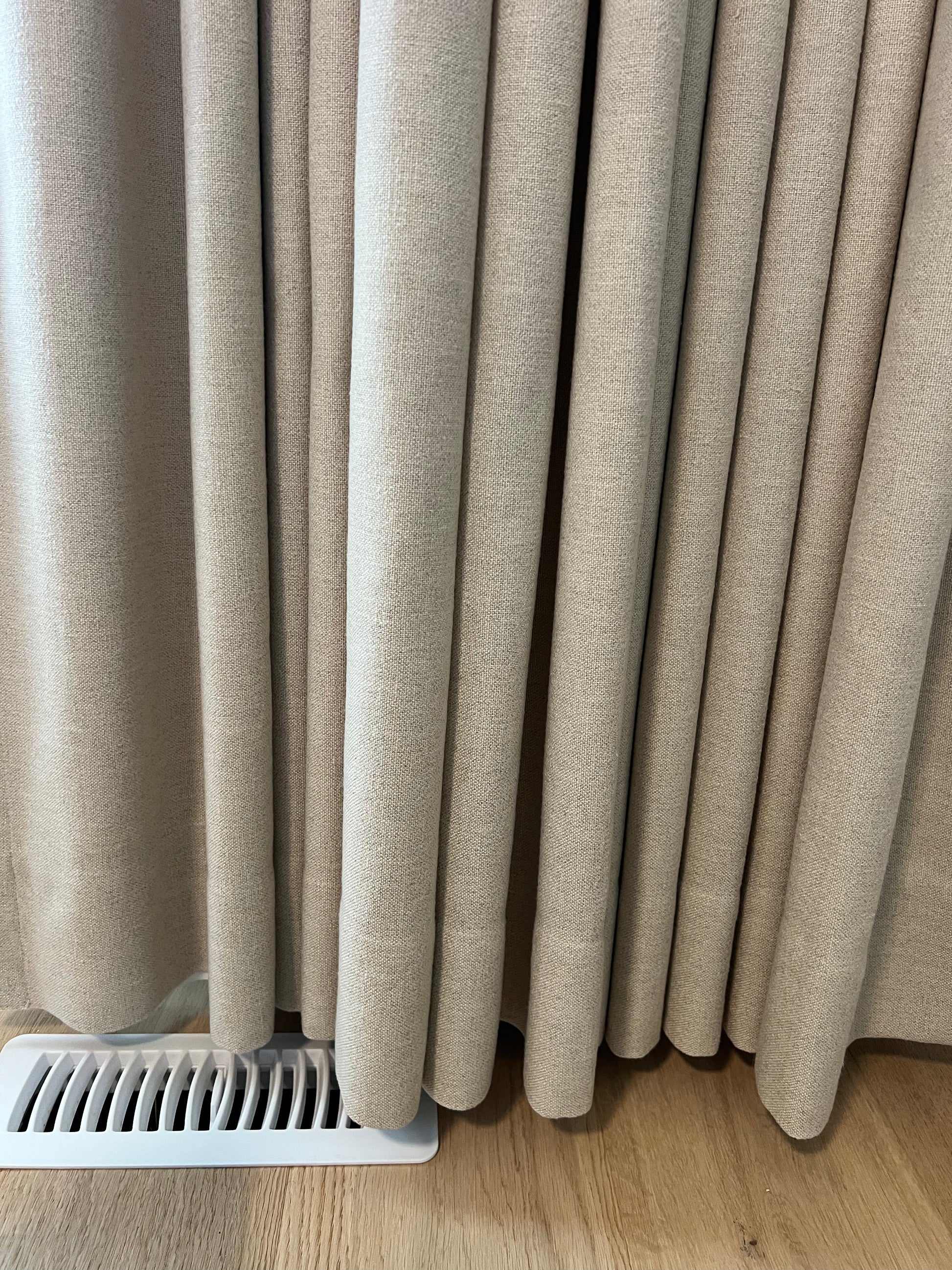 Far drapery panel in ripple fold style, lined custom panel shown in place