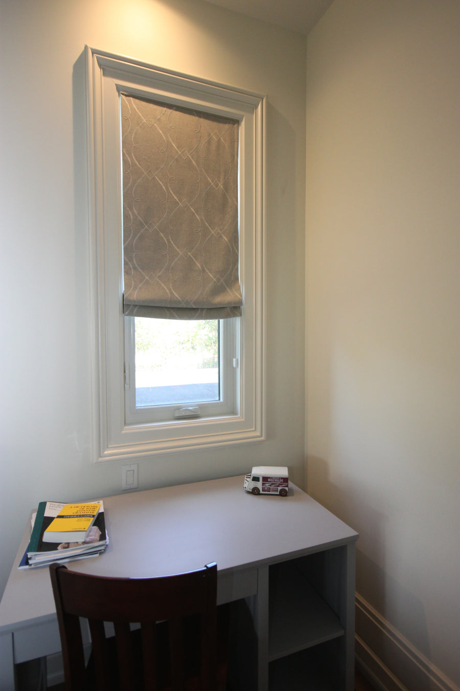 Home office with a linen Roman shade