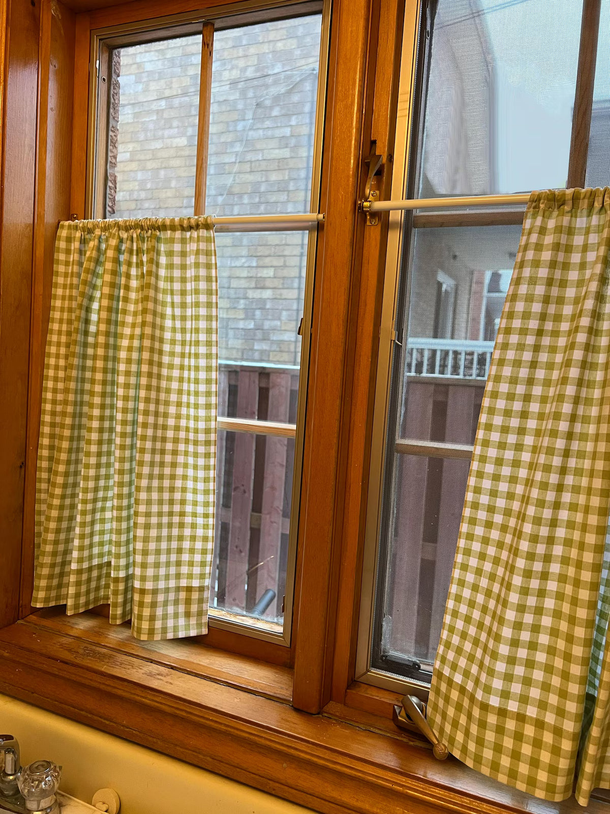 Café curtain on a French door hung on two rods, top and bottom