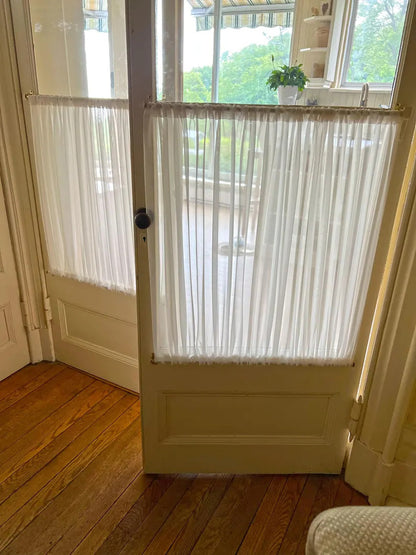 Round café curtain rod 7/16 inch in white mounted inside a kitchen window frame