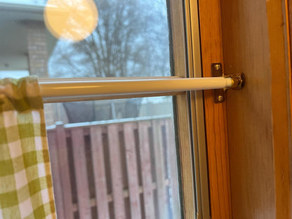 Macro of the café rod end and mounting bracket, steel construction visible