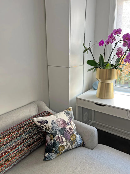 Velvet flowers cushion, styled with other pillows
