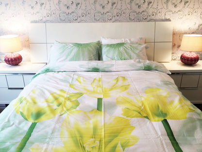 Floral cotton duvet cover set on a made queen bed