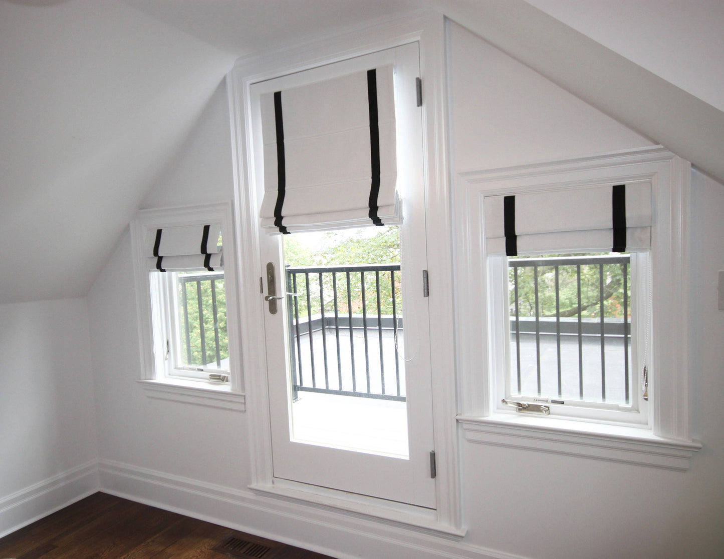 Aran linen flat Roman shades, white with black border, on three windows — custom size
