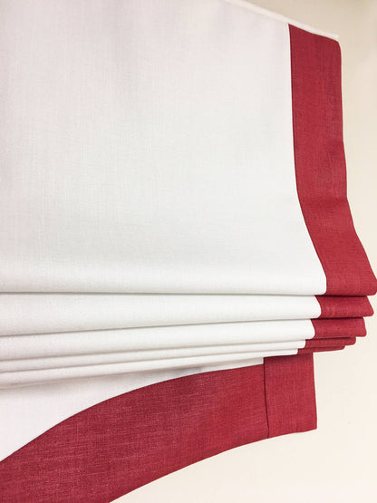 Relaxed roman shade raised, showing the soft curve of the bottom fold