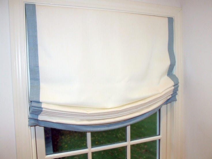Relaxed Roman shade detail, blue linen border
