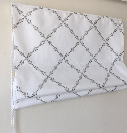 Ryder Silver relaxed Roman shade in white faux linen with grey embroidered sprig pattern
