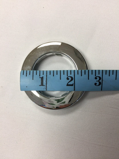 Silver grommet measured with a tape at 2 inches inner diameter