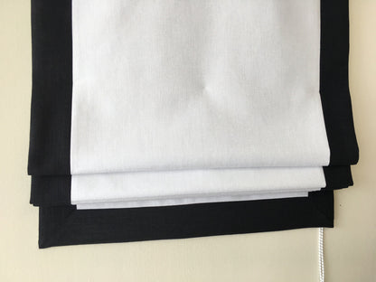 Made to order relaxed Roman shade, white faux linen with black edge