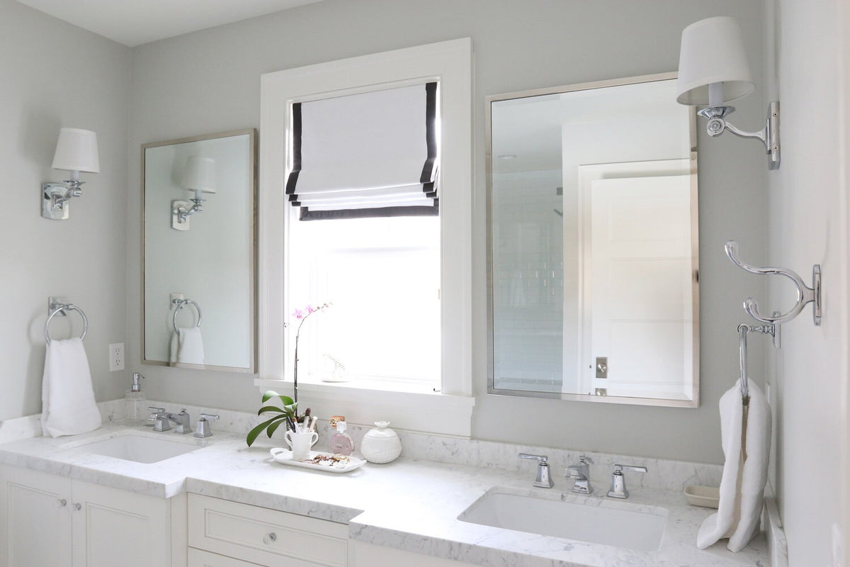 Relaxed Roman shade in white faux linen, black border detail