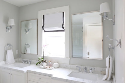 Relaxed Roman shade in white faux linen, black border detail
