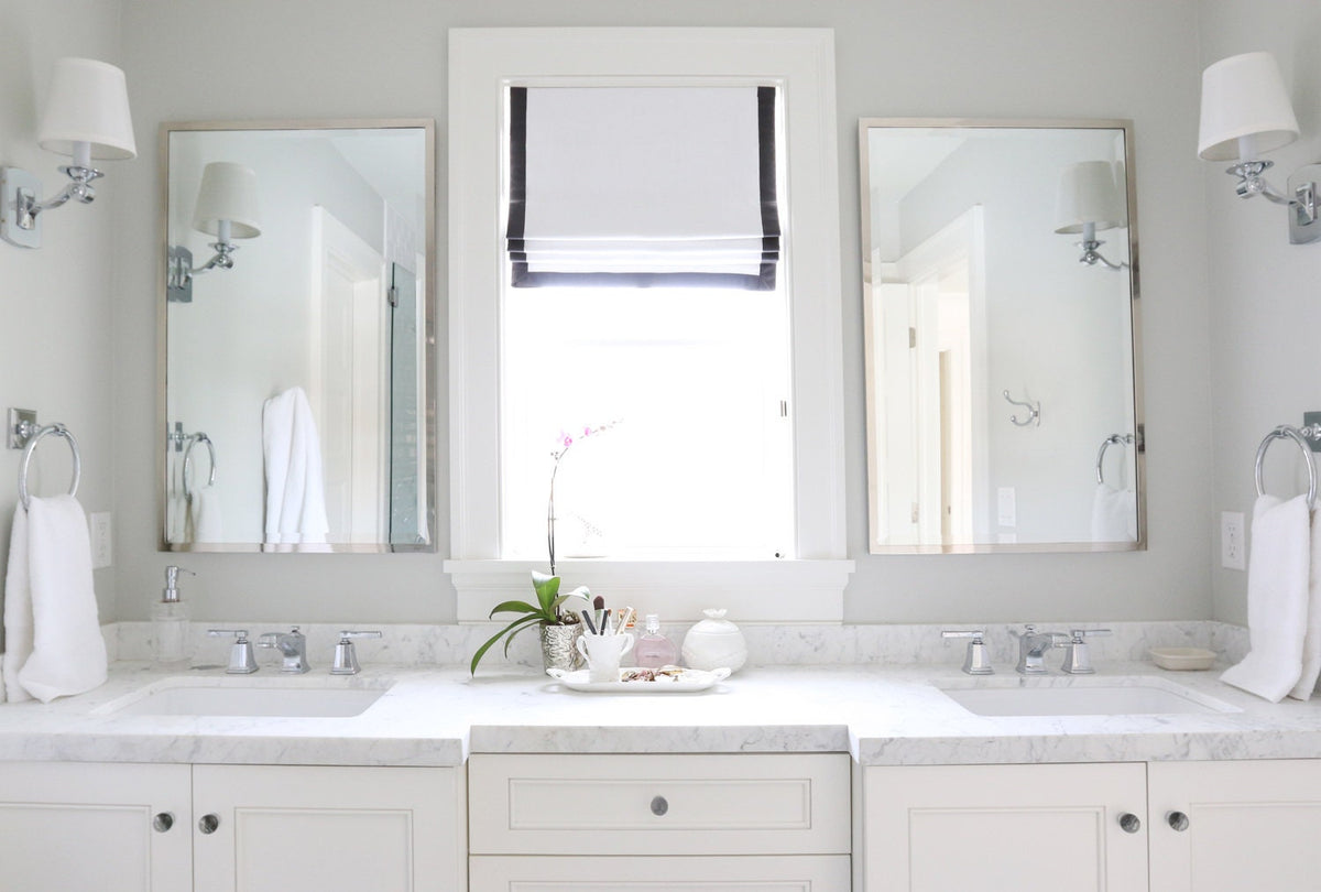 White linen-look relaxed Roman shade, black border, chain control