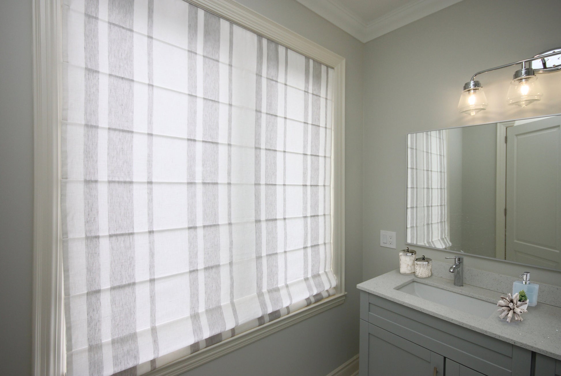 Striped flat Roman shade in a grey and white bathroom — LOGANOVA