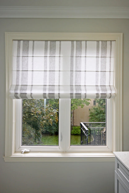 Gothic Stripe flat Roman shade half-raised on a casement window — LOGANOVA