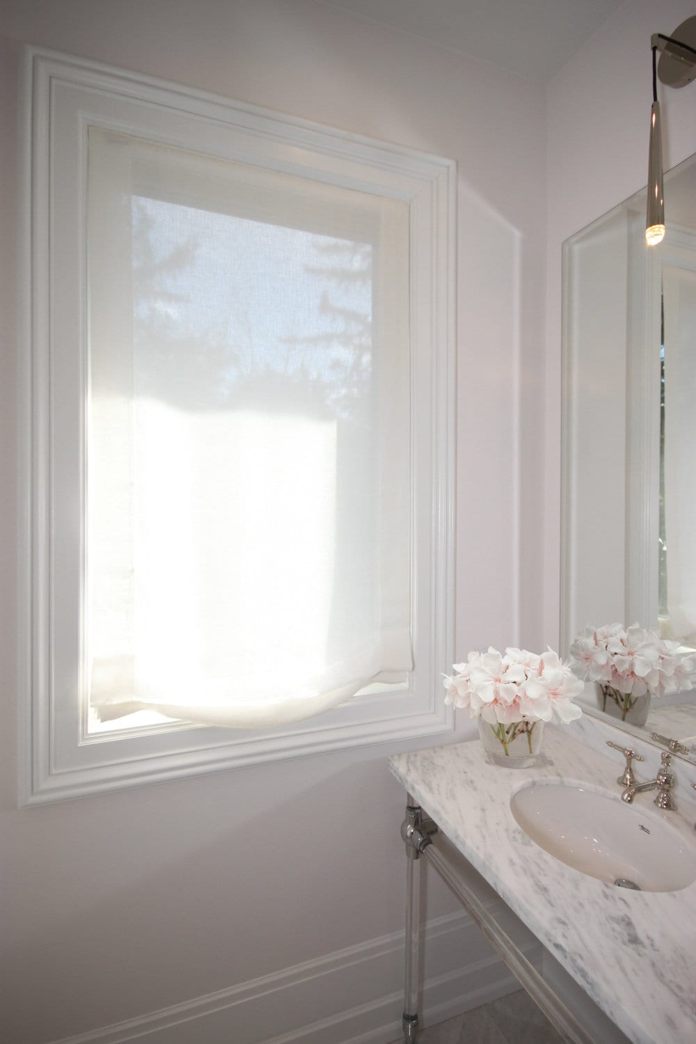 Daylight glowing through a Utopia sheer linen Roman shade, privacy kept — LOGANOVA