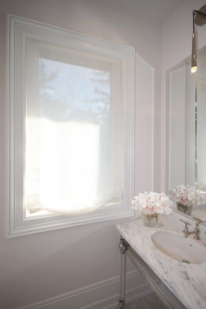 Daylight glowing through a Utopia sheer linen Roman shade, privacy kept — LOGANOVA