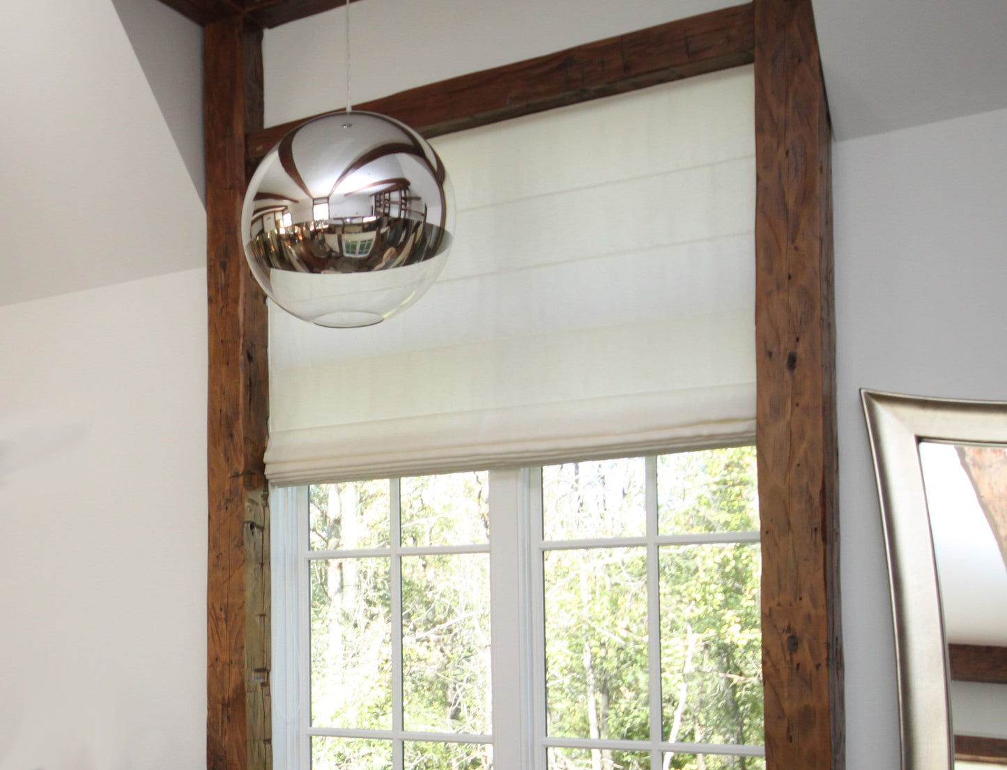 Inside-mounted flat Roman shade fitted to a wood-framed window — LOGANOVA