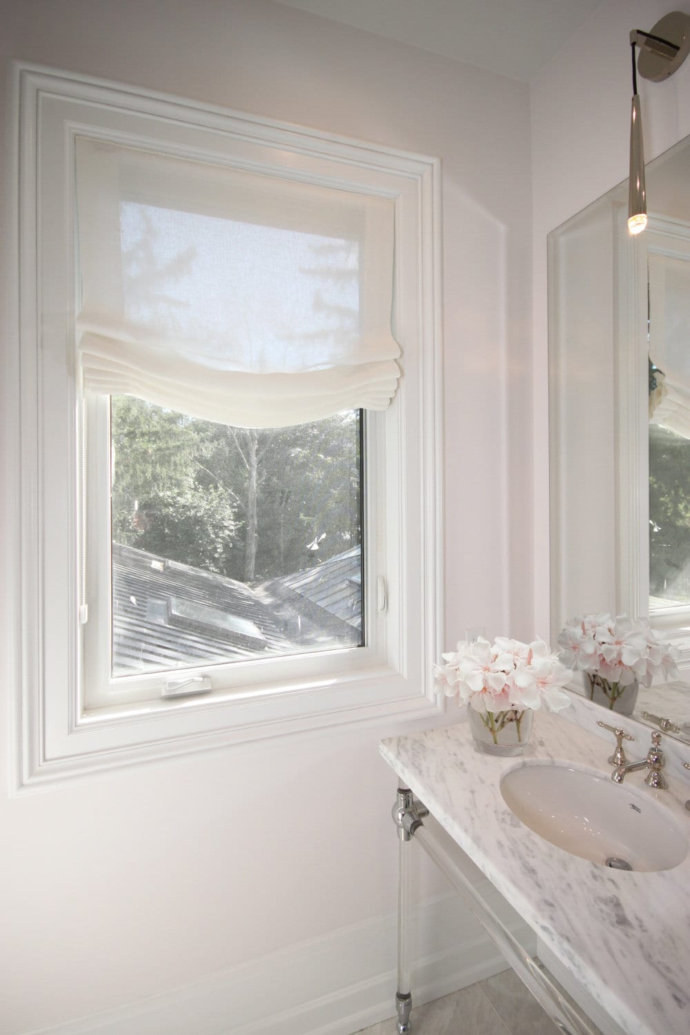 Utopia sheer linen relaxed Roman shade in a bright bathroom window, soft sag fold — LOGANOVA