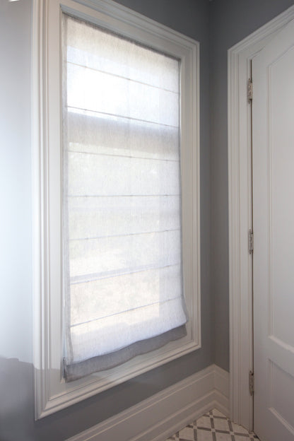 Close-up of sheer linen weave on a custom Roman shade