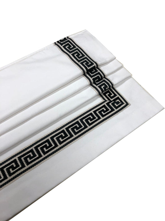 White faux Roman shade valance with black Greek key trim, folded profile — LOGANOVA