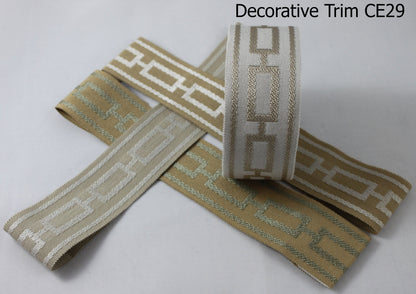 Close view of the woven geometric decorative trim on a Cheval Roman shade