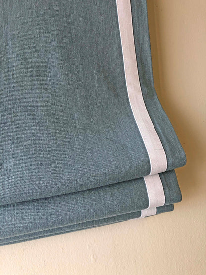Close-up of the relaxed fold and weighted hem on a Regatta linen shade
