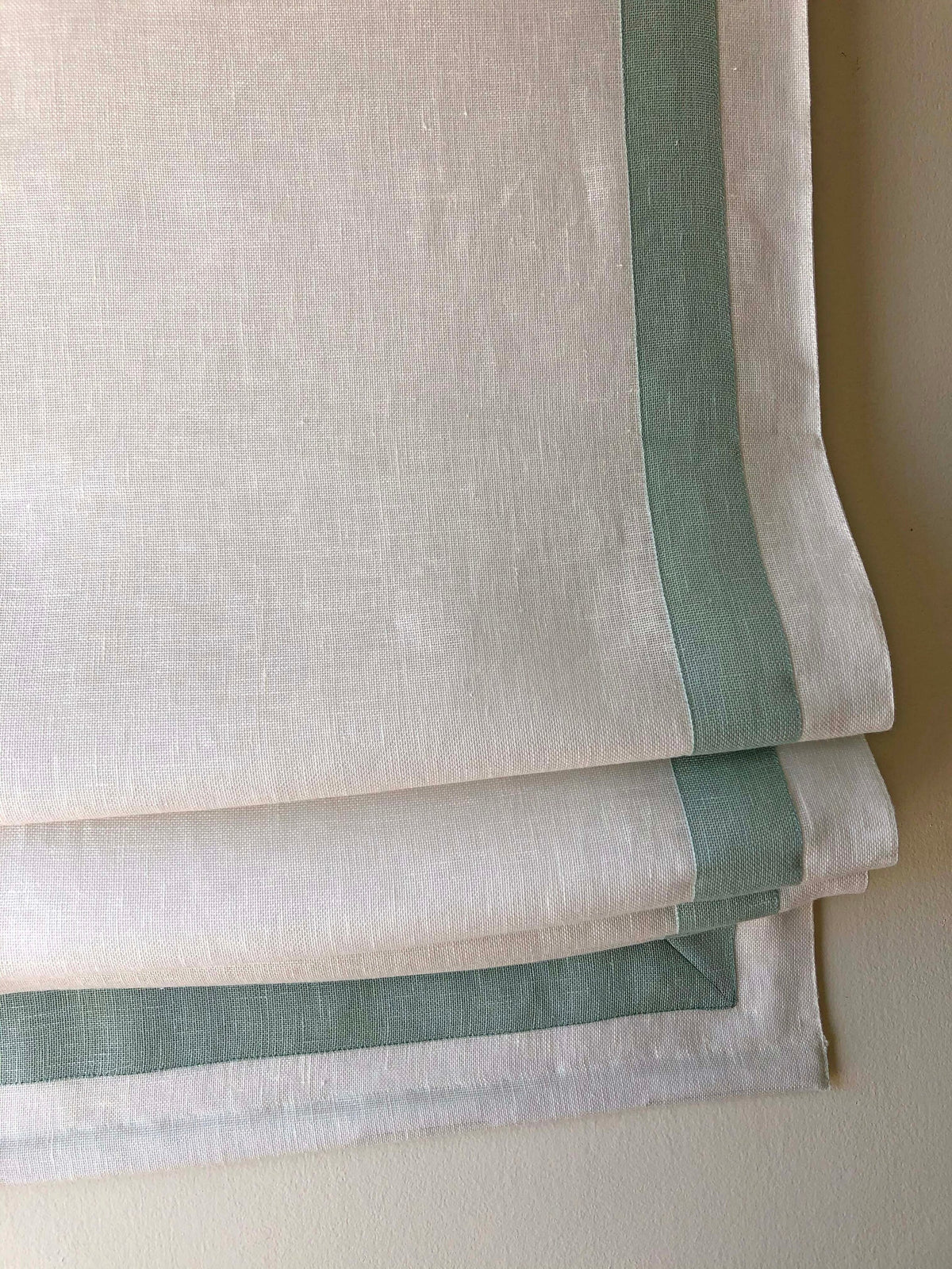 Cordoba linen relaxed Roman shade with Rendezvous contrast border