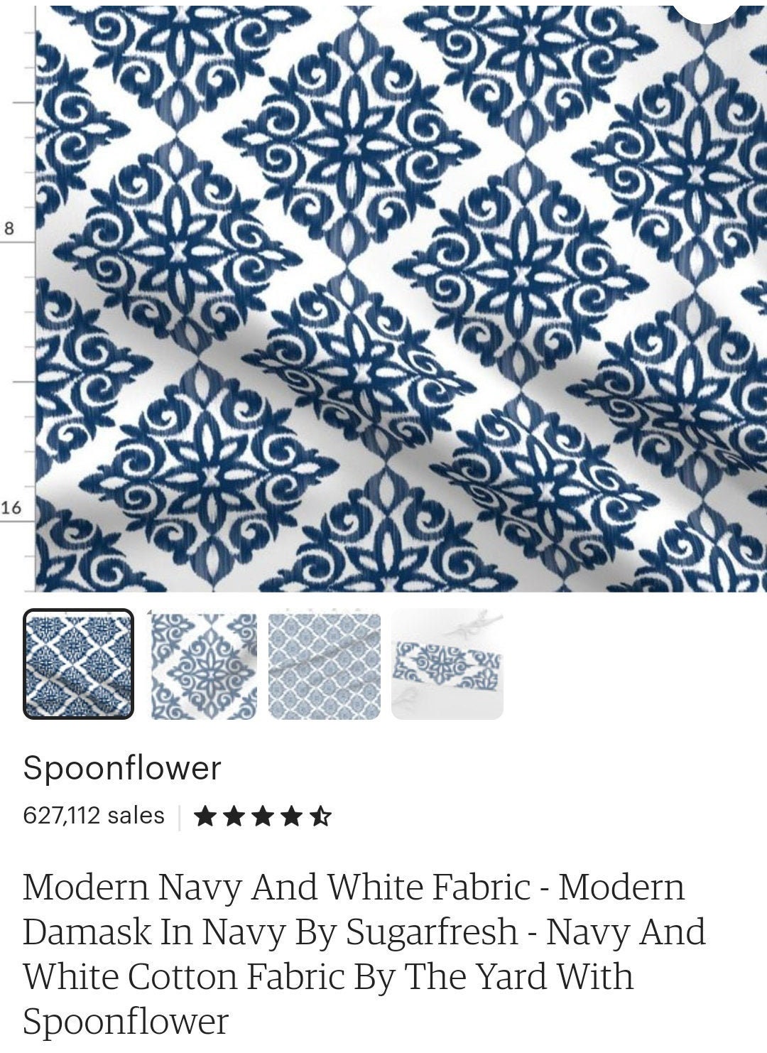 Navy damask relaxed Roman shade in a styled interior