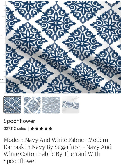 Navy damask relaxed Roman shade in a styled interior