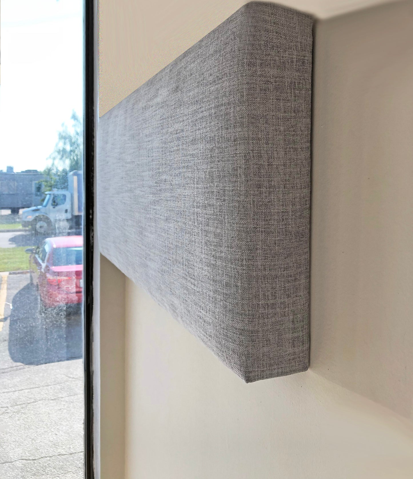 Three-quarter view of the cornice showing the padded return depth — LOGANOVA