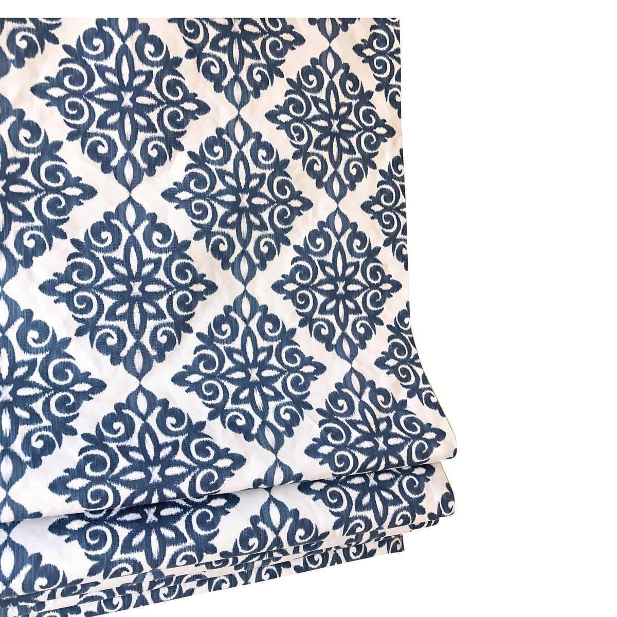 Navy damask Roman shade lowered, full pattern across the window