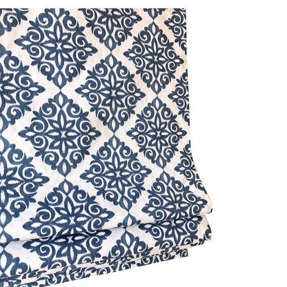 Navy damask Roman shade lowered, full pattern across the window