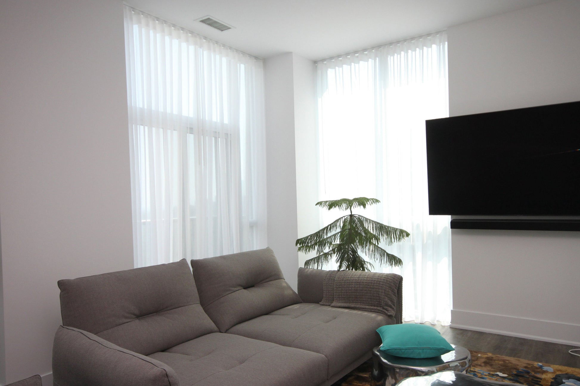 White Berlin sheer ripple fold curtains in a modern living room — LOGANOVA
