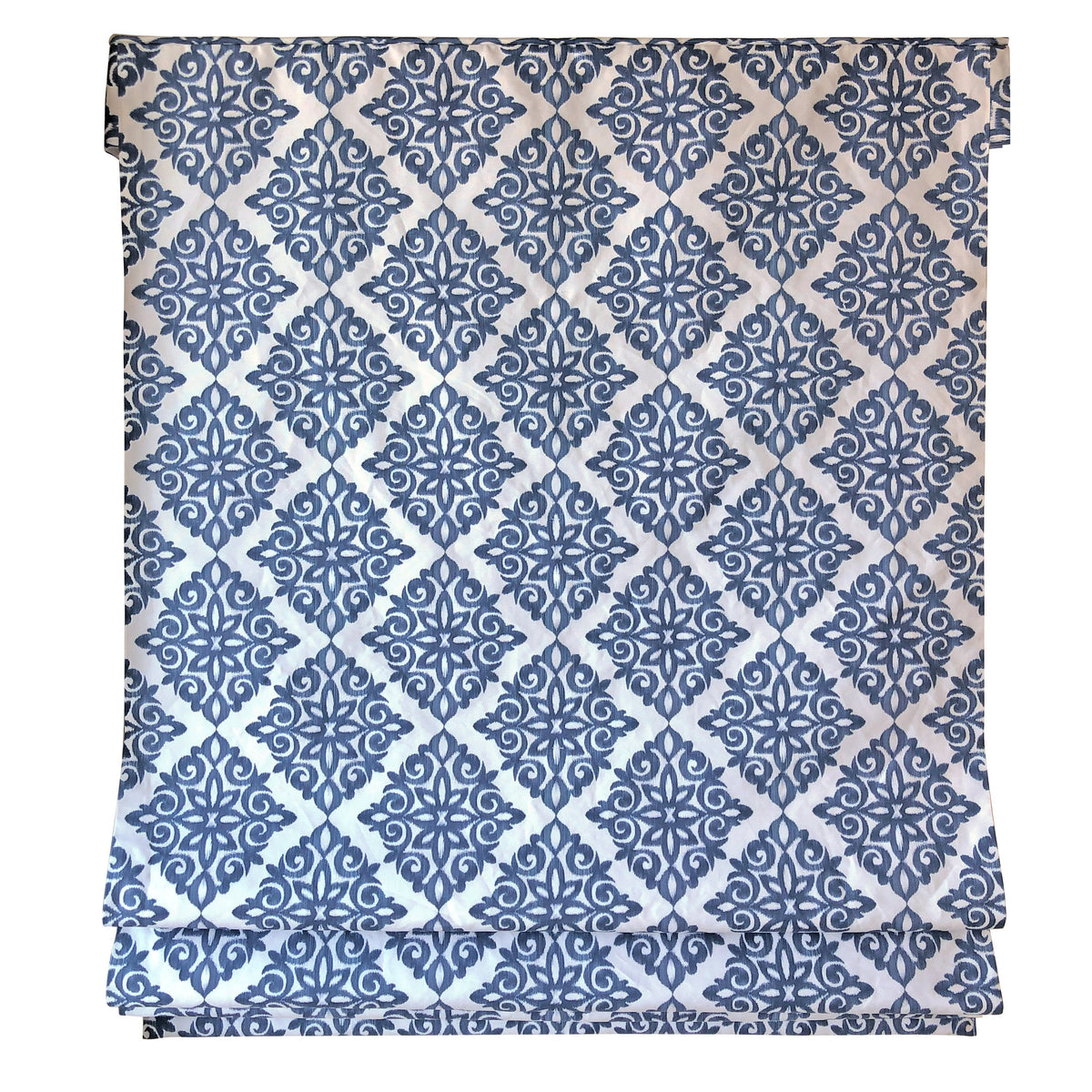Relaxed fold detail of the navy damask Roman shade