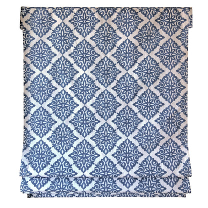 Relaxed fold detail of the navy damask Roman shade
