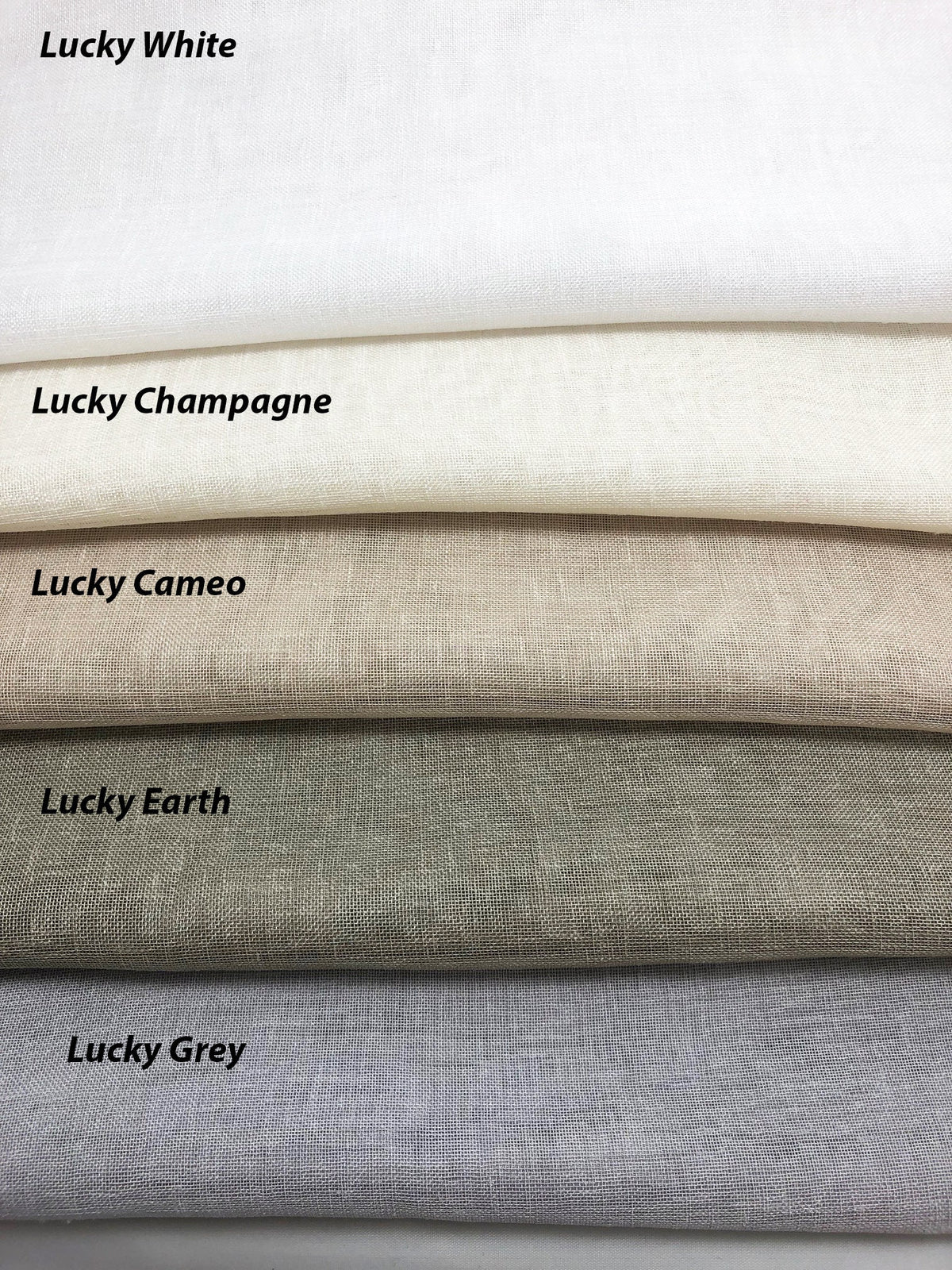 Lucky sheer swatches stacked from White through Champagne, Cameo, Earth and Grey