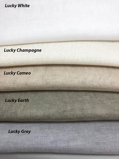 Lucky sheer swatches stacked from White through Champagne, Cameo, Earth and Grey