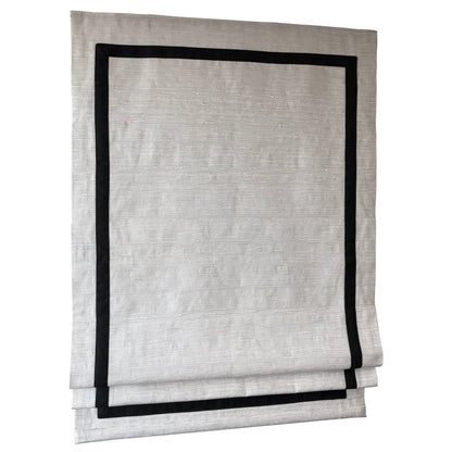Athens cotton relaxed Roman shade with four-sided inset border, fully extended — front view