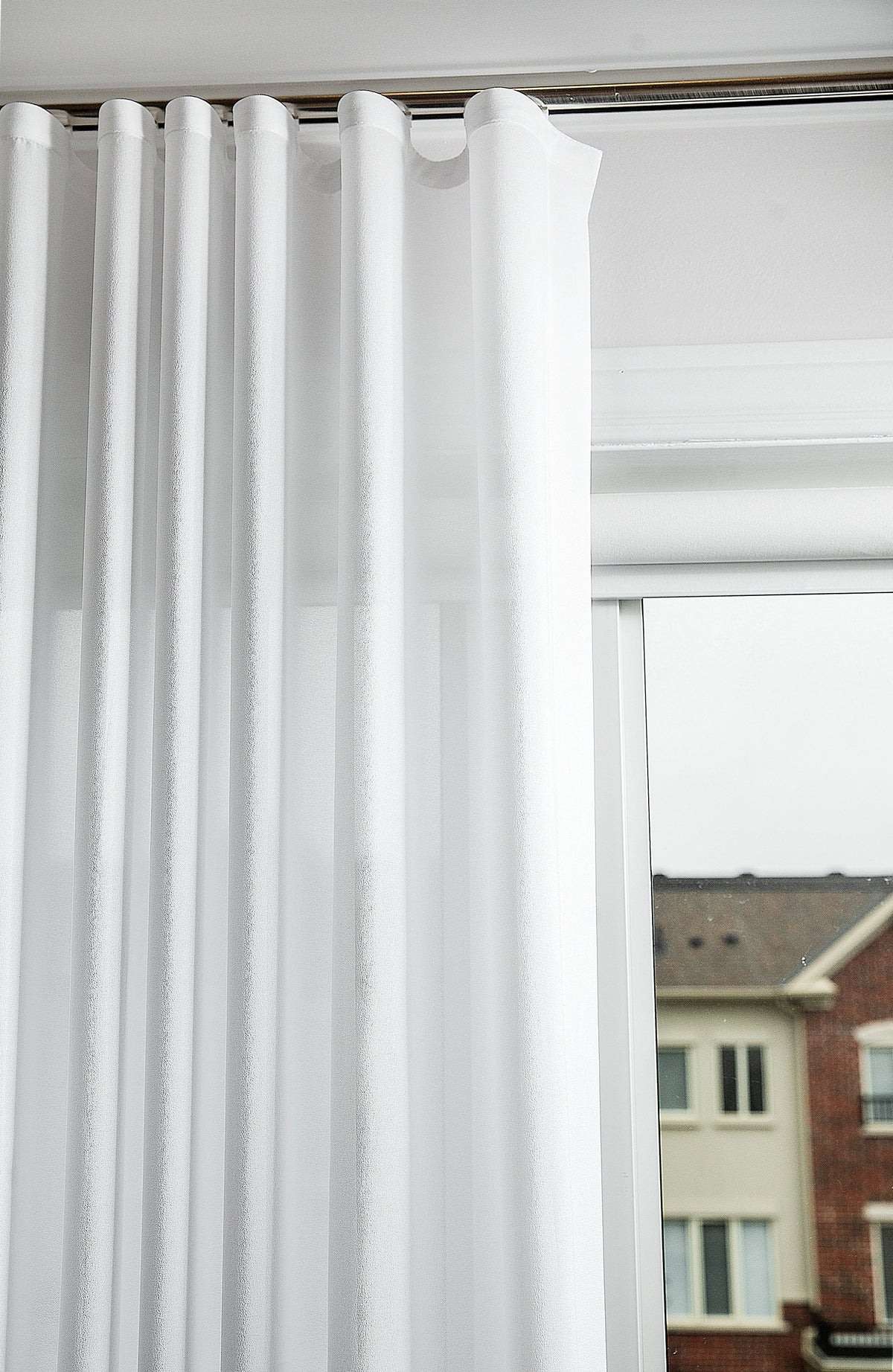 Kidman sheer s-fold panel filtering daylight while keeping the room private from the street