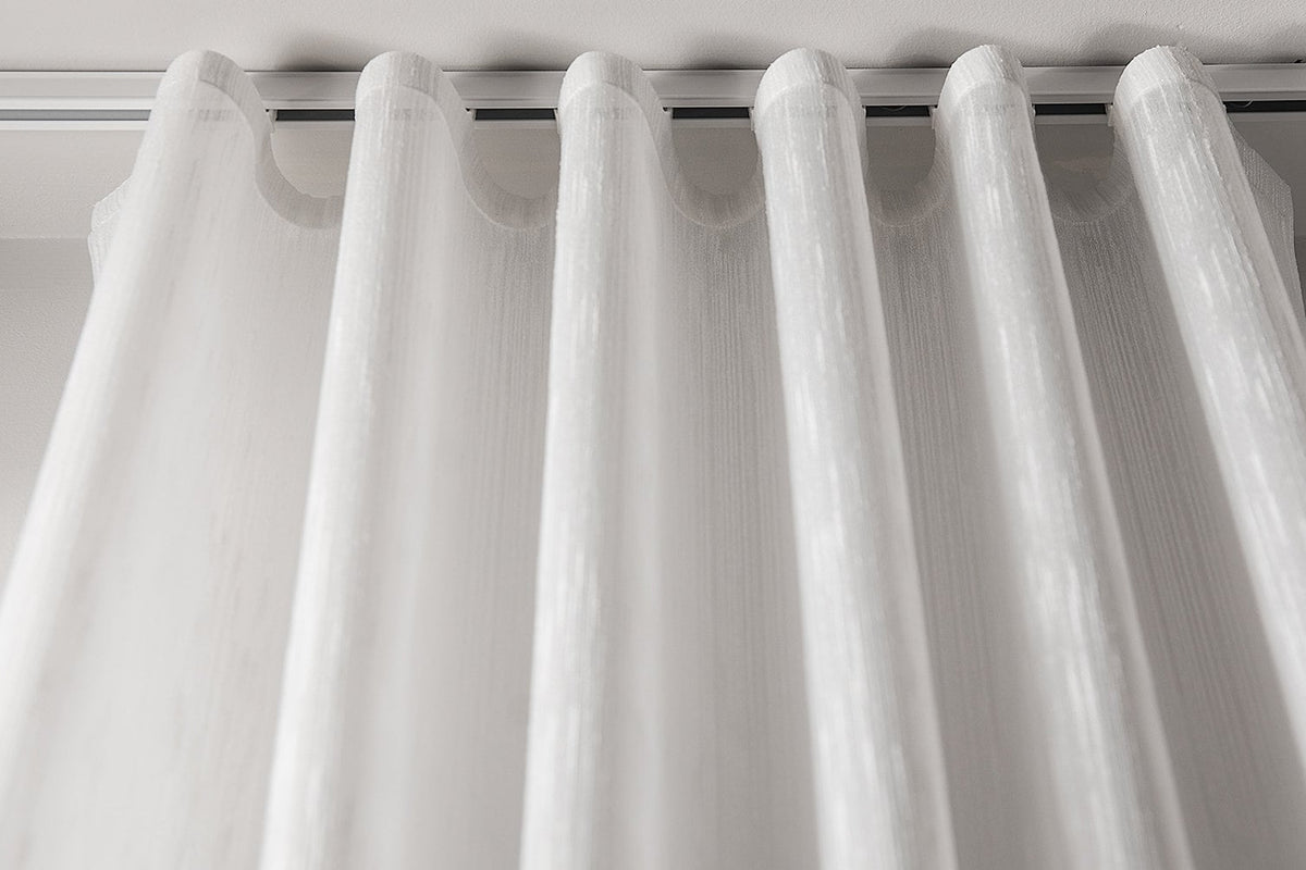 Lugano semi-sheer ripple fold drapery panel hanging in even S-folds