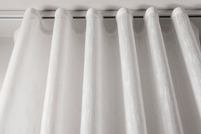 Lugano semi-sheer ripple fold drapery panel hanging in even S-folds