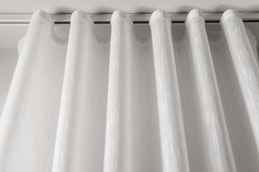 Lugano semi-sheer ripple fold drapery panel hanging in even S-folds