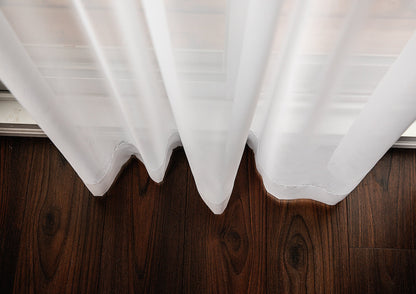 Weighted bottom hem of Empire voile panel over wood floor — LOGANOVA