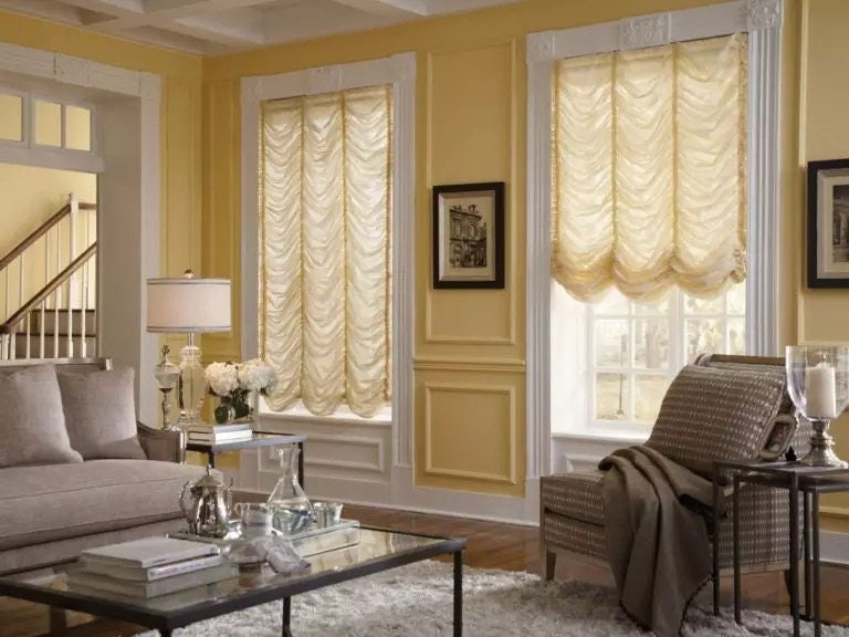 Austrian sheer shade hung in a bright window, soft gathered folds