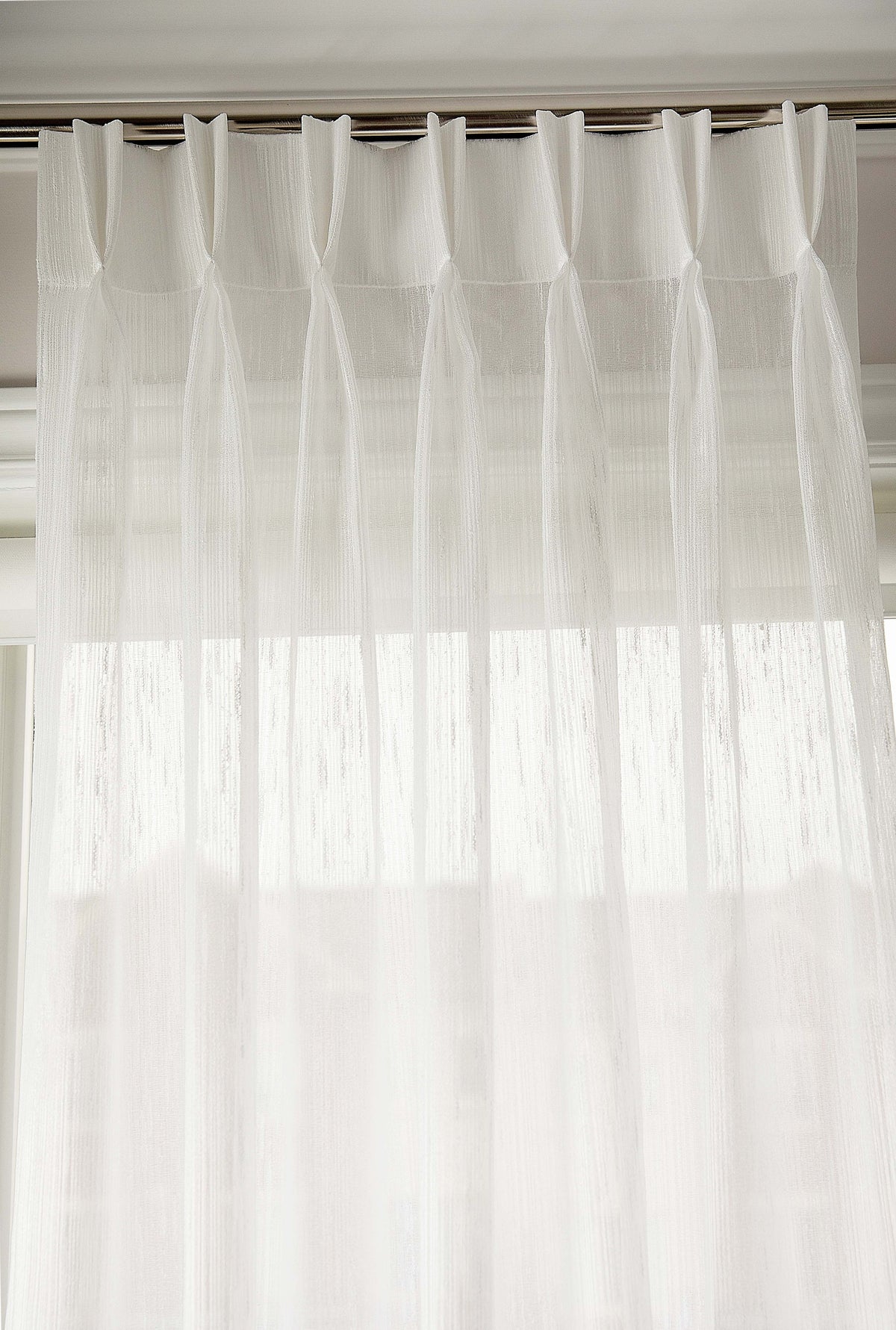 Triple pleat heading detail with pre-installed drapery hooks