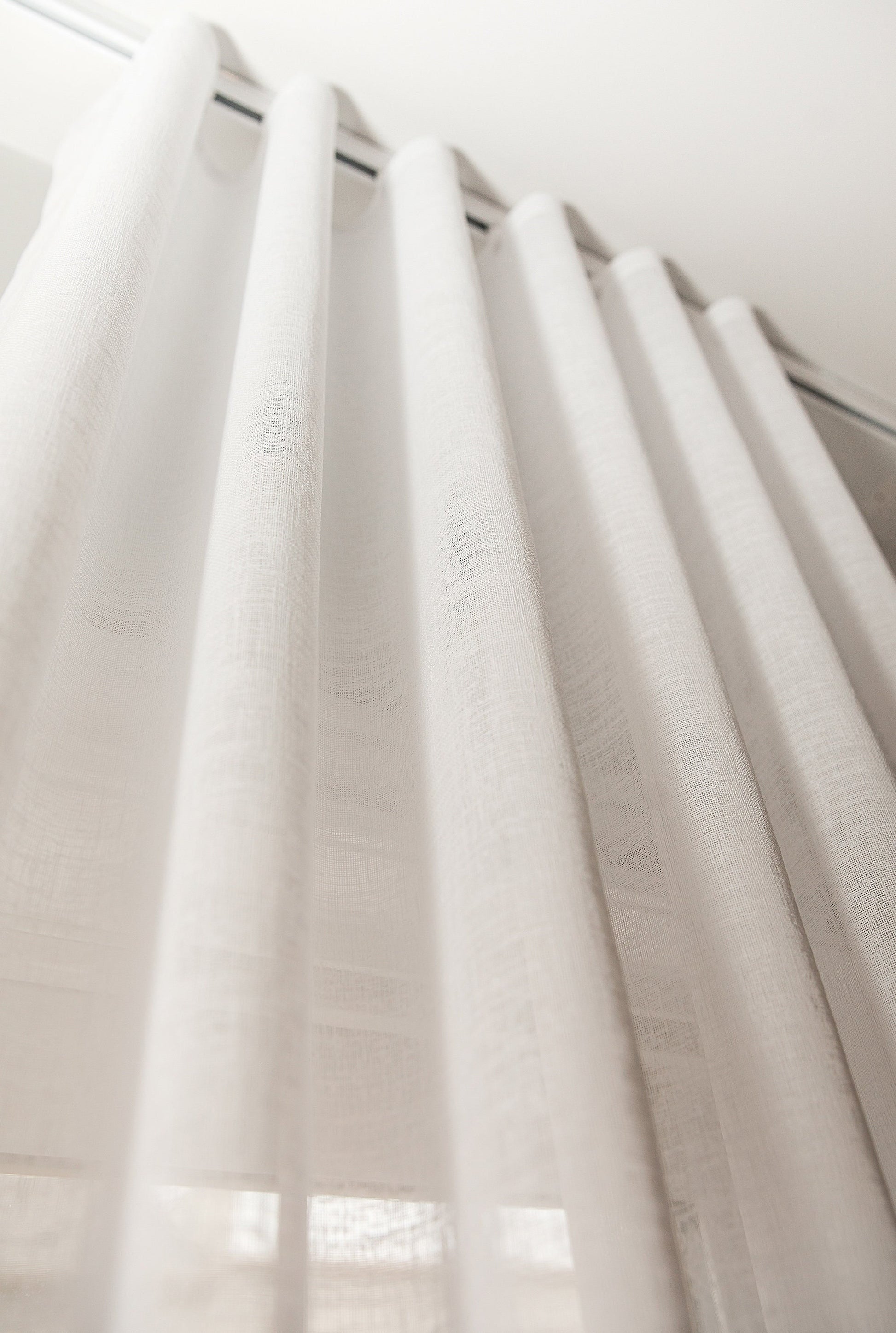 Berlin sheer ripple fold curtains on channel track, continuous S-wave — LOGANOVA